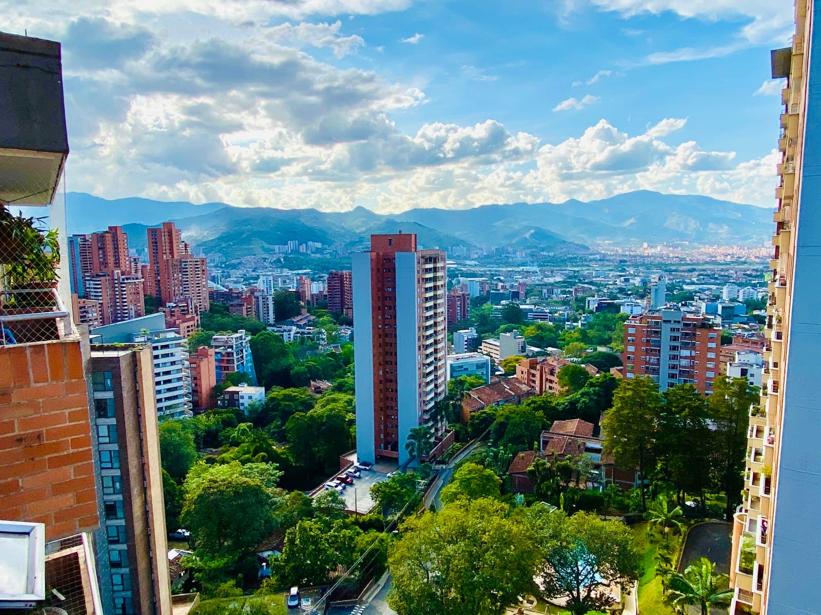 Residential towers in El Poblado, Medellín, with the mountains in the background — illustrative photo